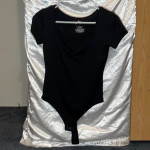 This is a one piece in the size small from a brand “So”. The color is black.